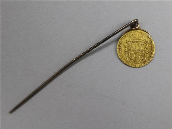 A George VI Gold coin mounted on a pin